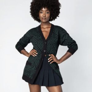 Woman wearing a Mansa oversized cardigan, standing comfortably