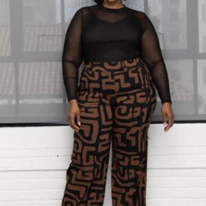 Woman wearing Thema wide-leg stretch pants, standing confidently